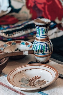 a table topped with plates and bowls on top of a table