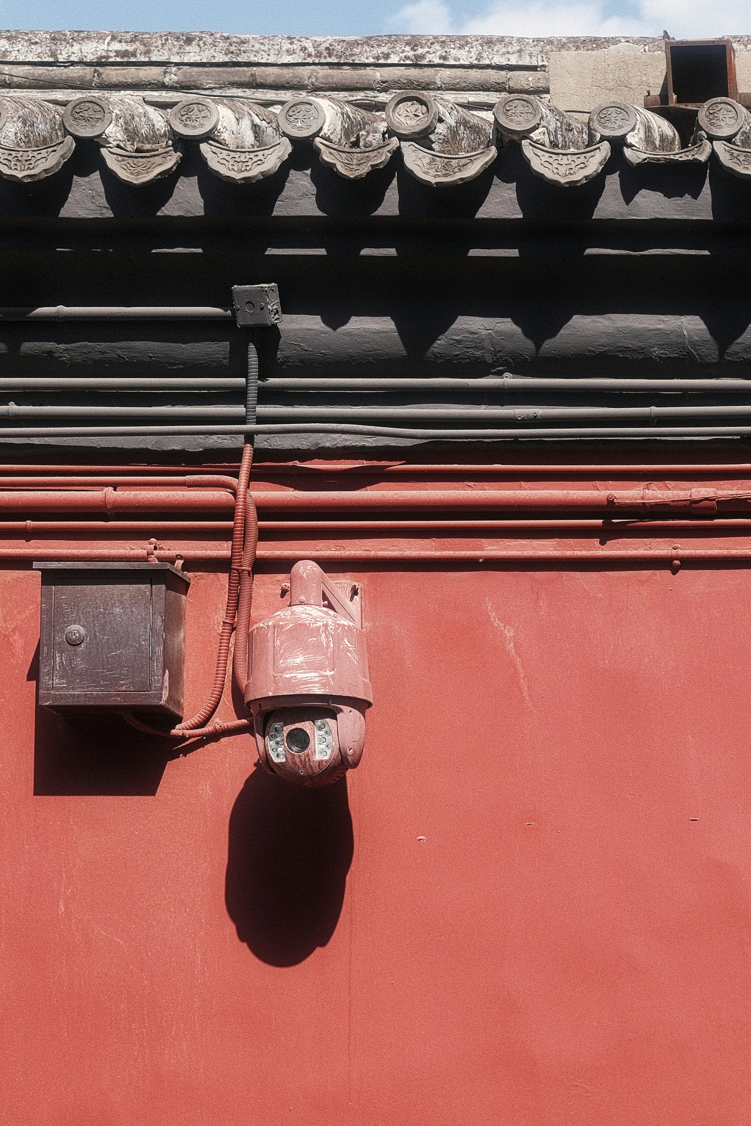 a security camera attached to the side of a building