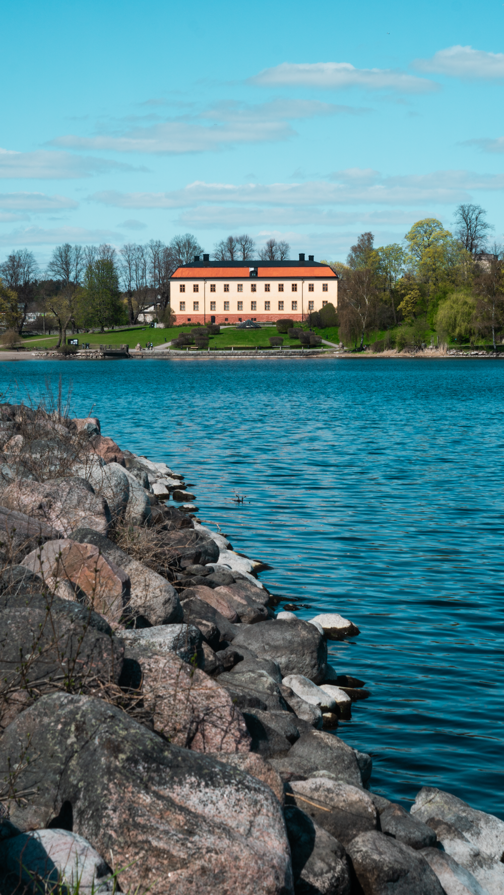 a large white building sitting on top of a lake