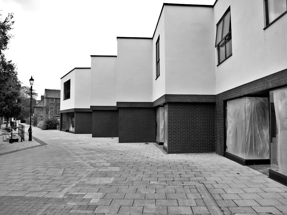 a black and white photo of a row of buildings