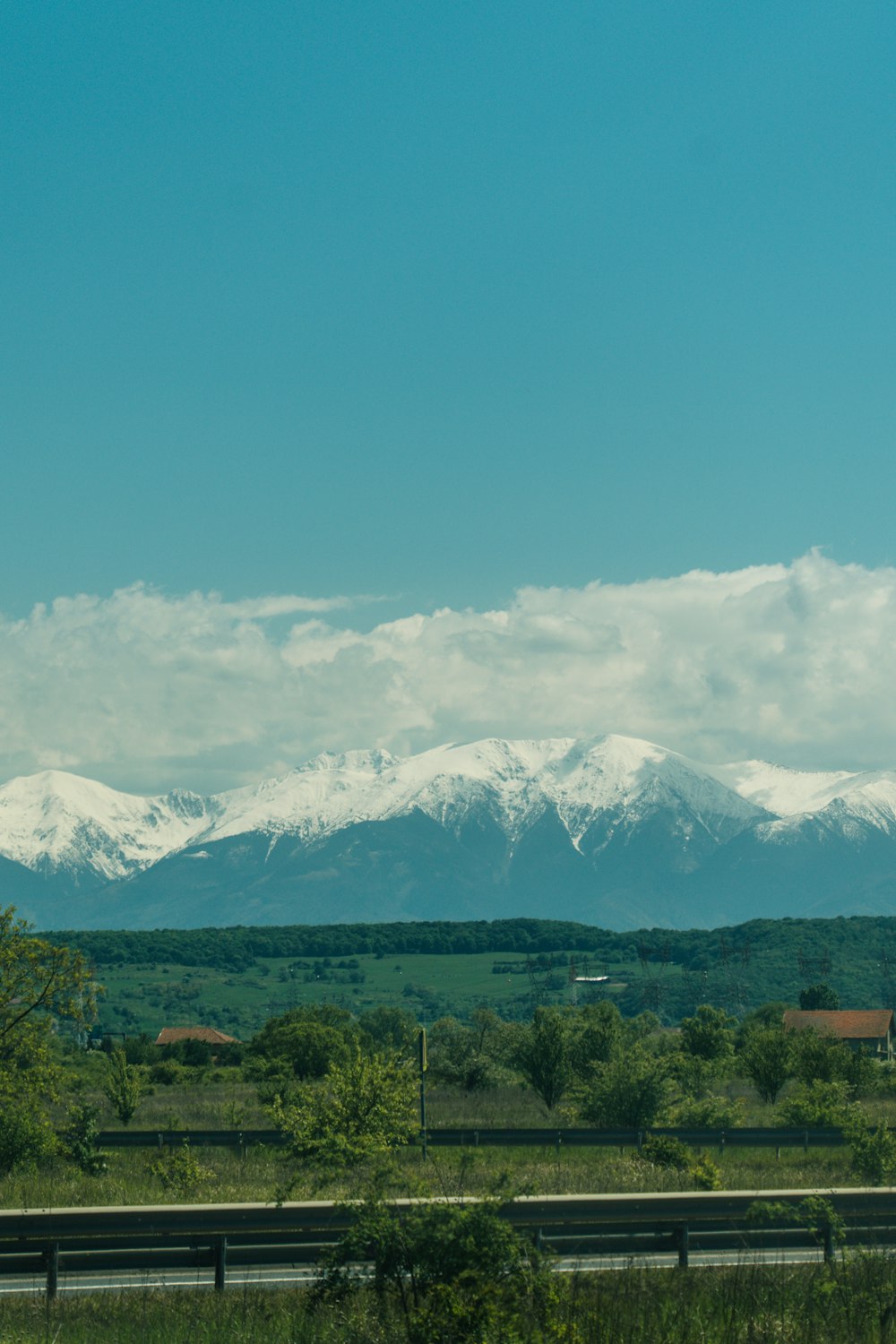 a view of a mountain range from a highway