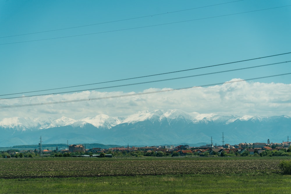 a view of a mountain range with power lines in the foreground