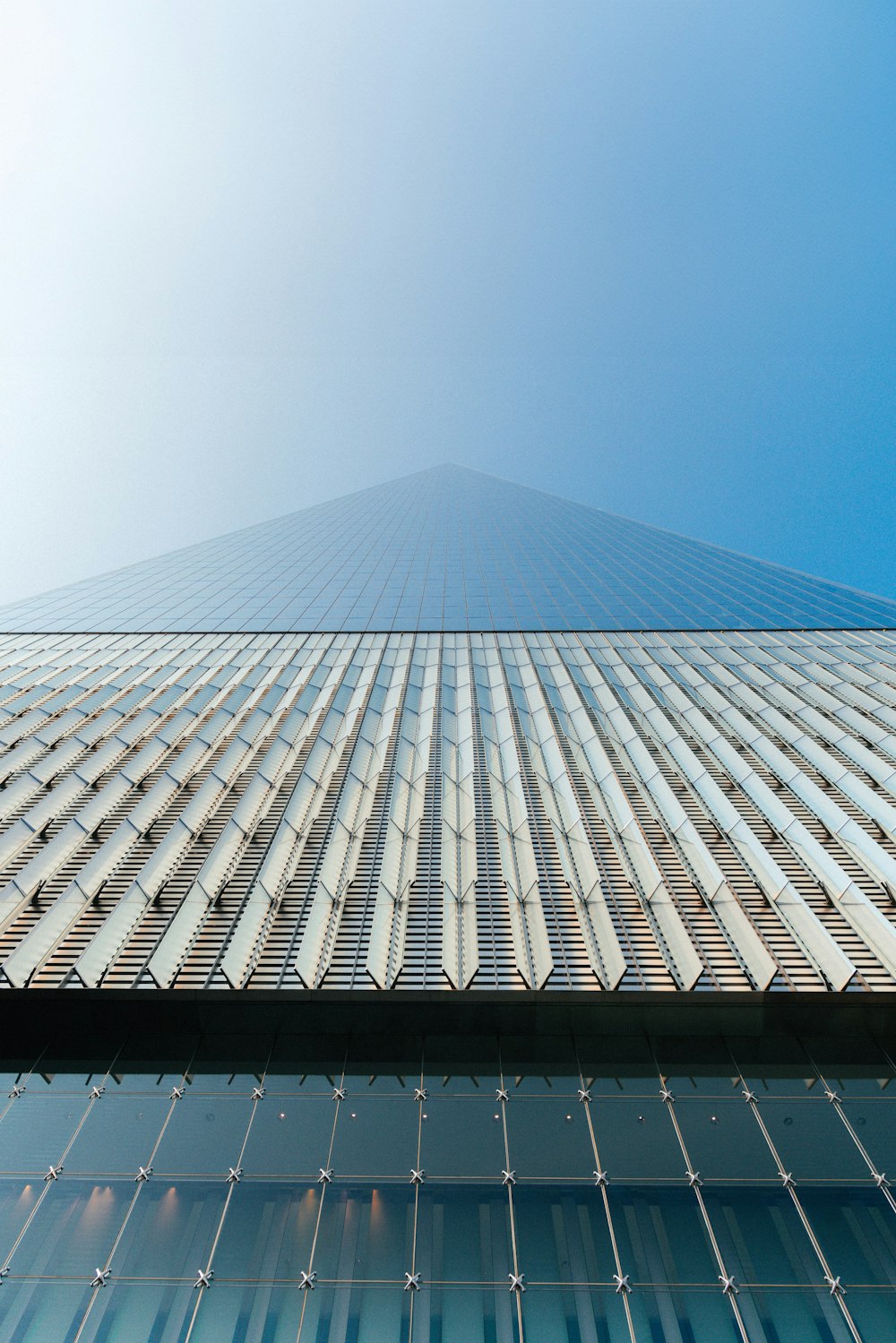 a very tall building with a sky in the background