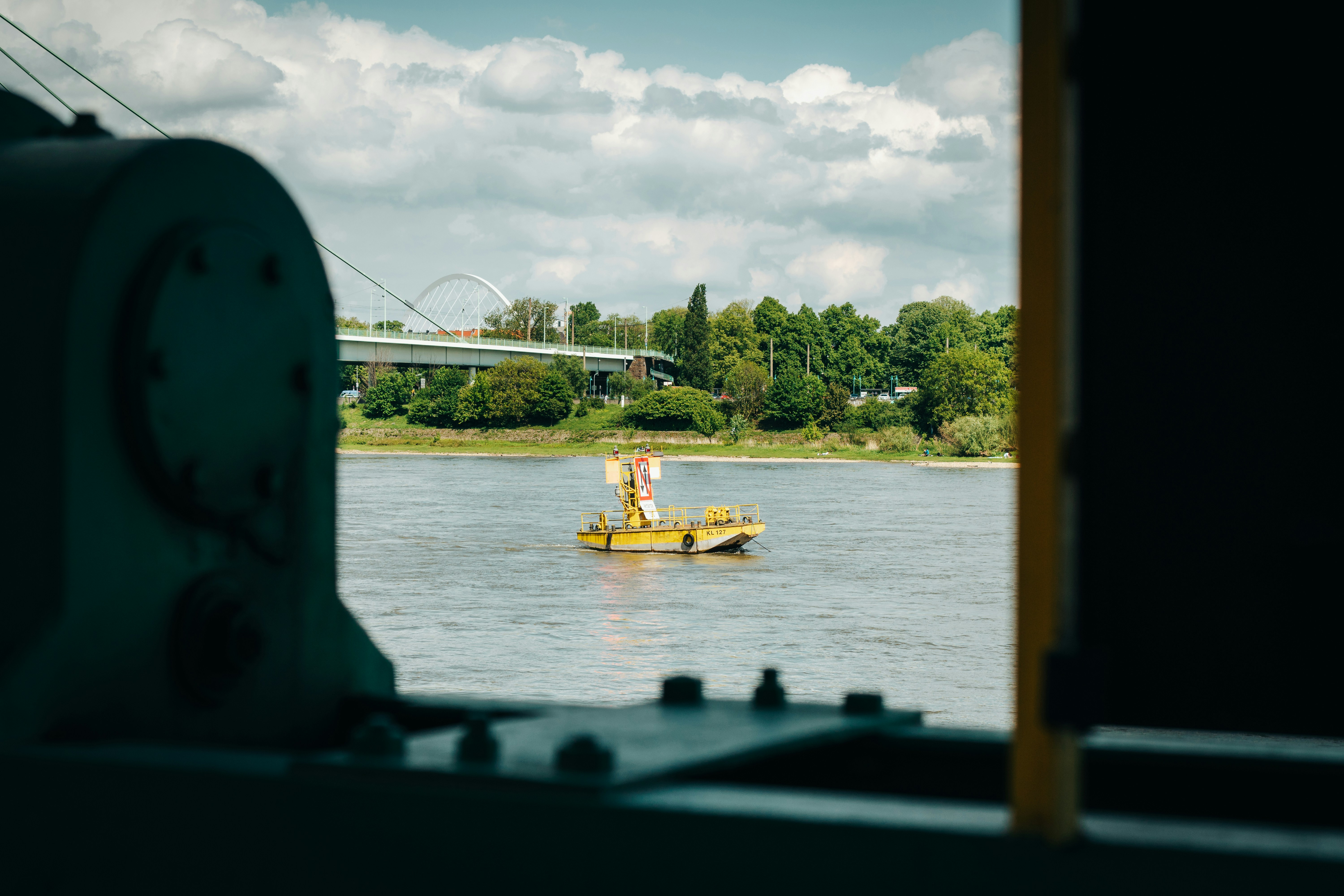 a man in a yellow boat on a body of water