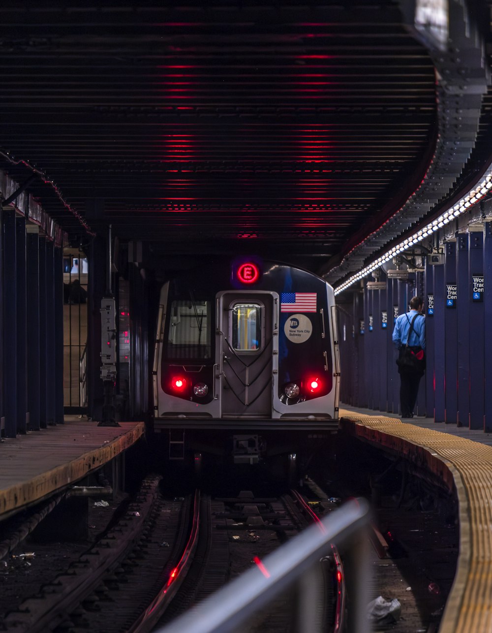 a subway train pulling into a train station