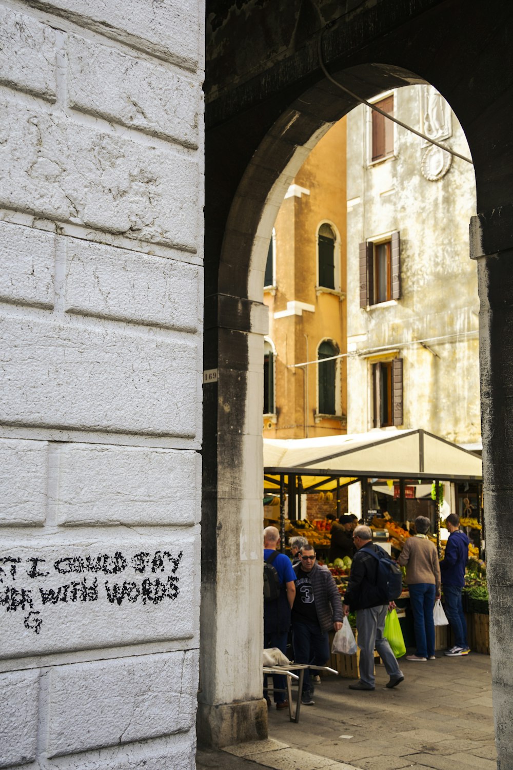 a group of people standing outside of a building