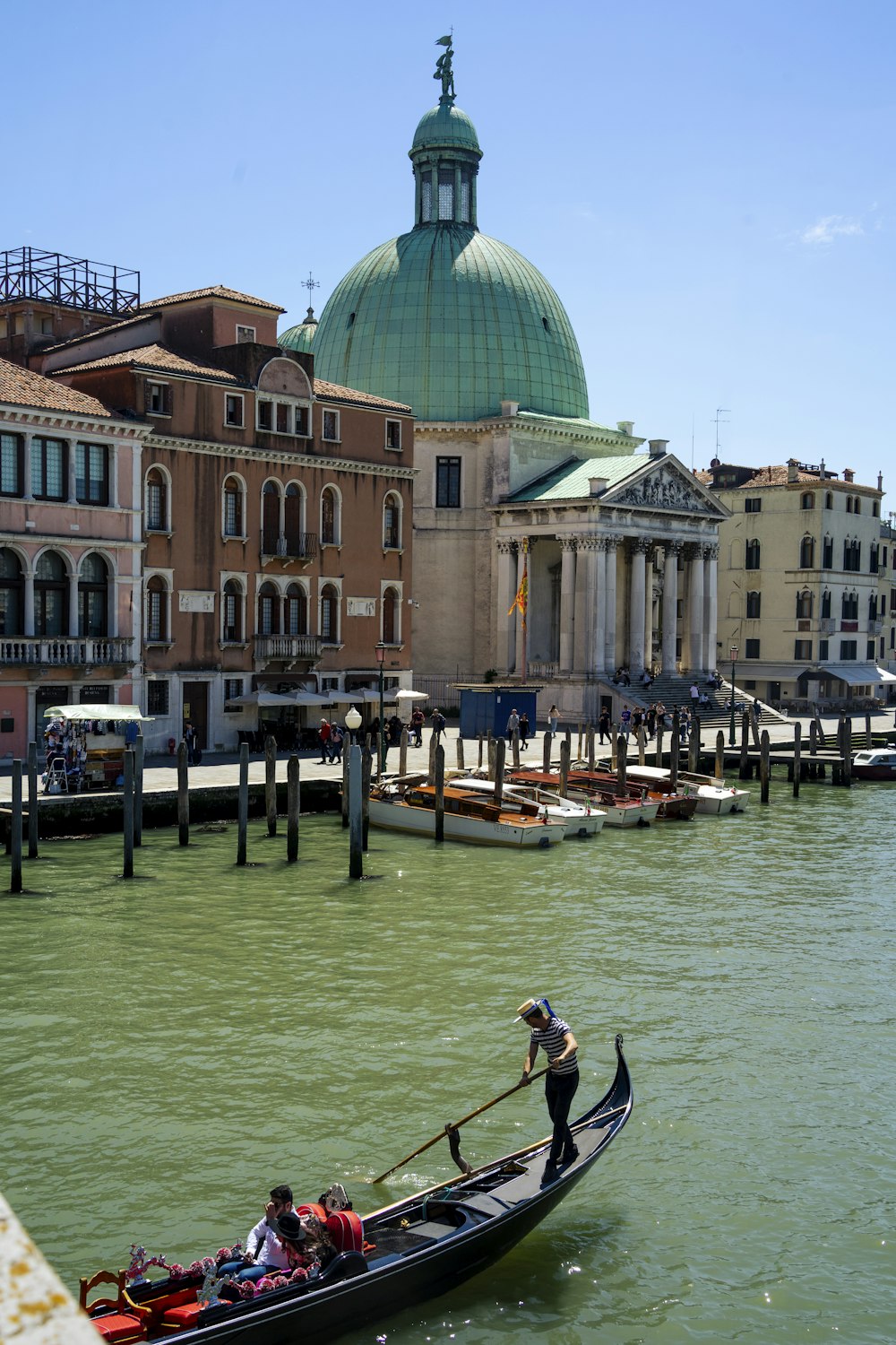 a gondola in front of a building on the water