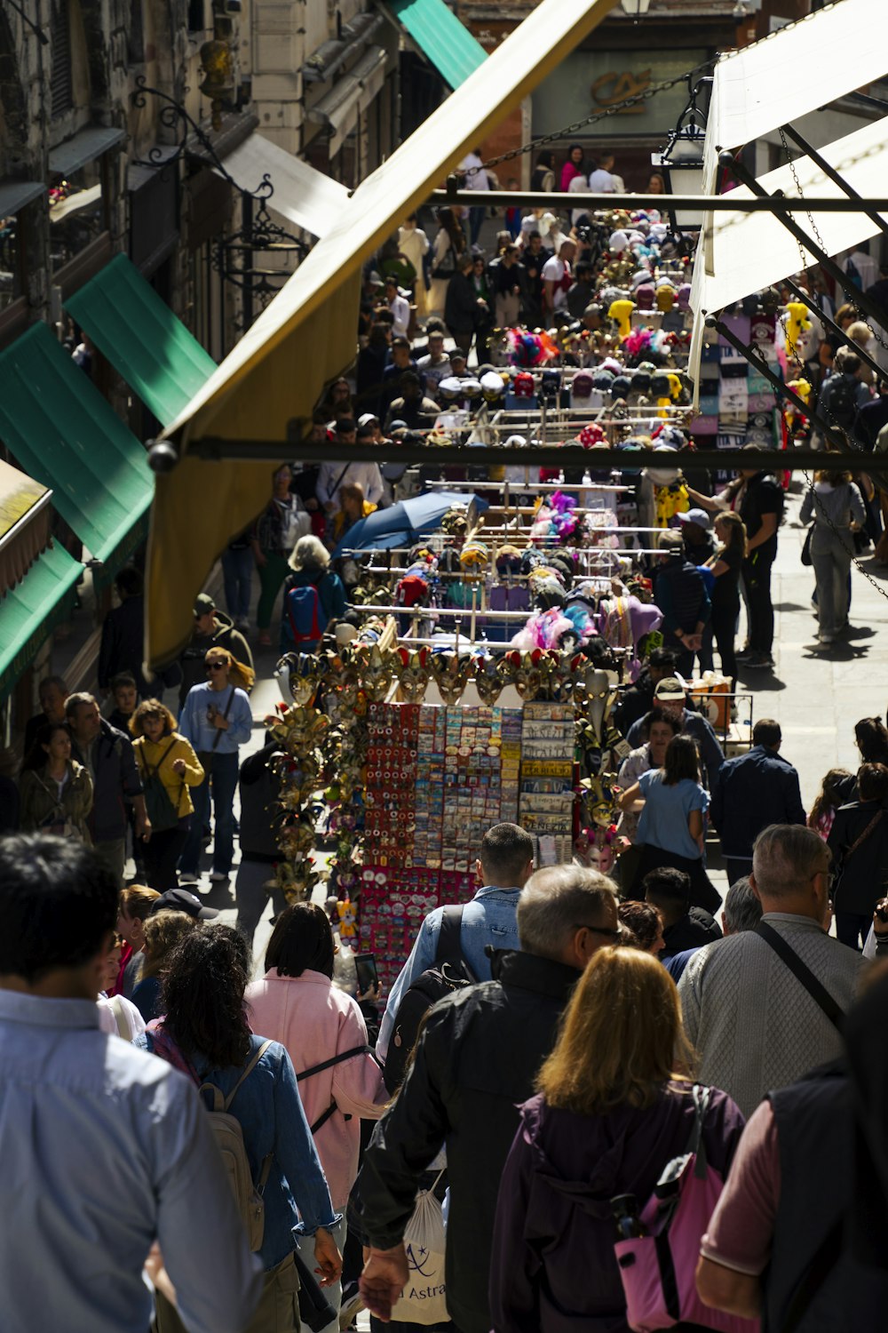 a crowd of people walking down a street