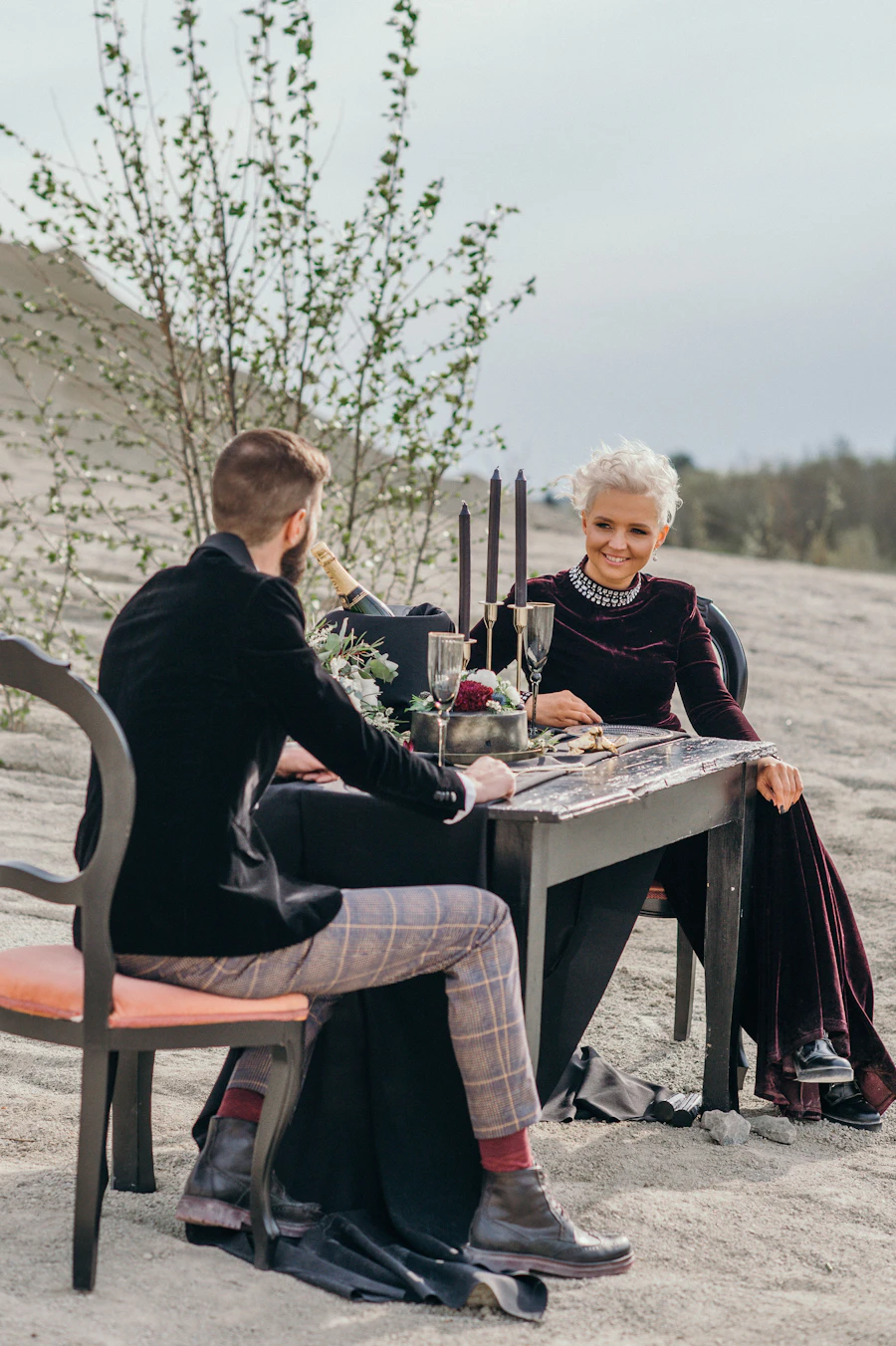 Two people talking warmly across a table during an unhurried one-to-one conversation