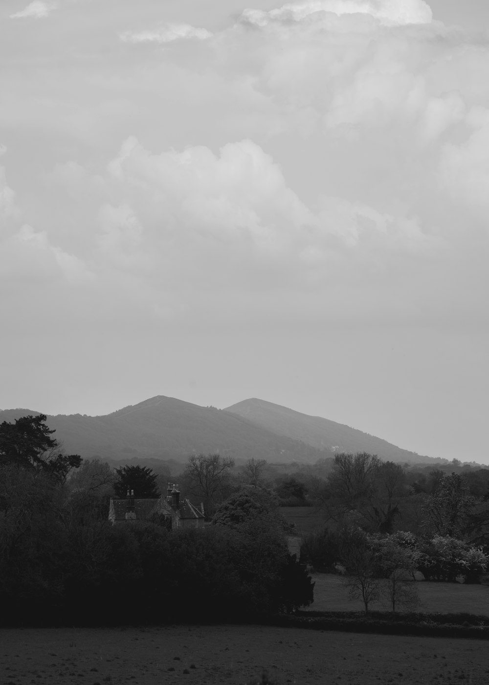 a black and white photo of a mountain range