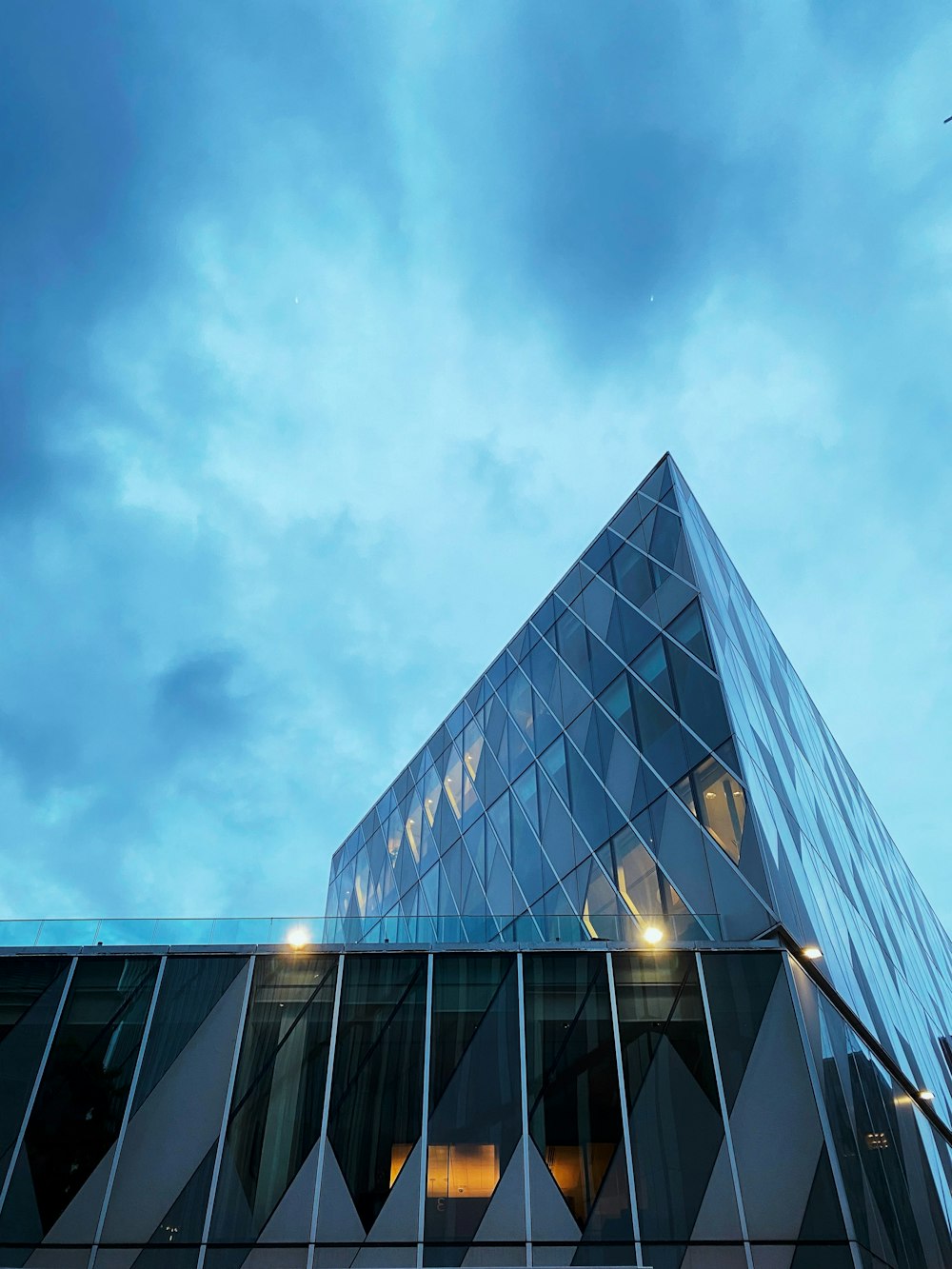 a very tall building with a sky background