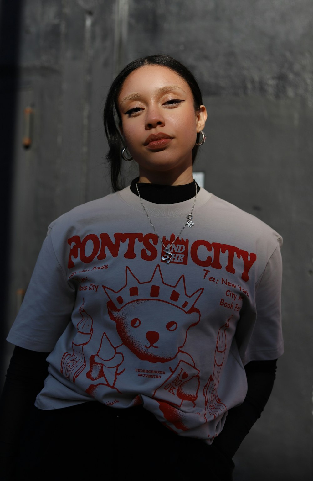 a woman wearing a t - shirt with a dog on it