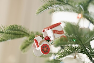 a christmas ornament hanging from a christmas tree