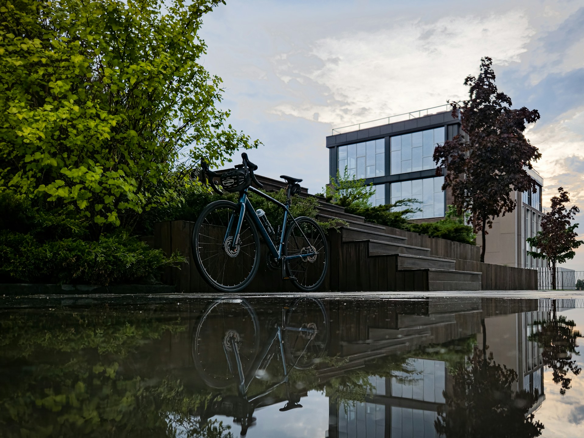 a bike parked next to a set of stairs