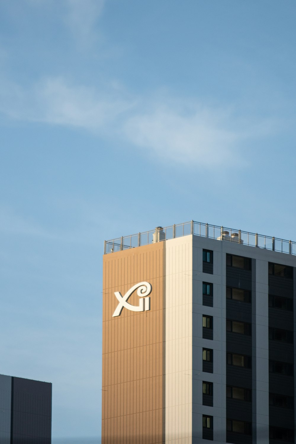 a tall building with a sky background