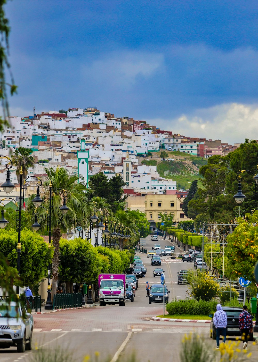 a view of a city with a hill in the background