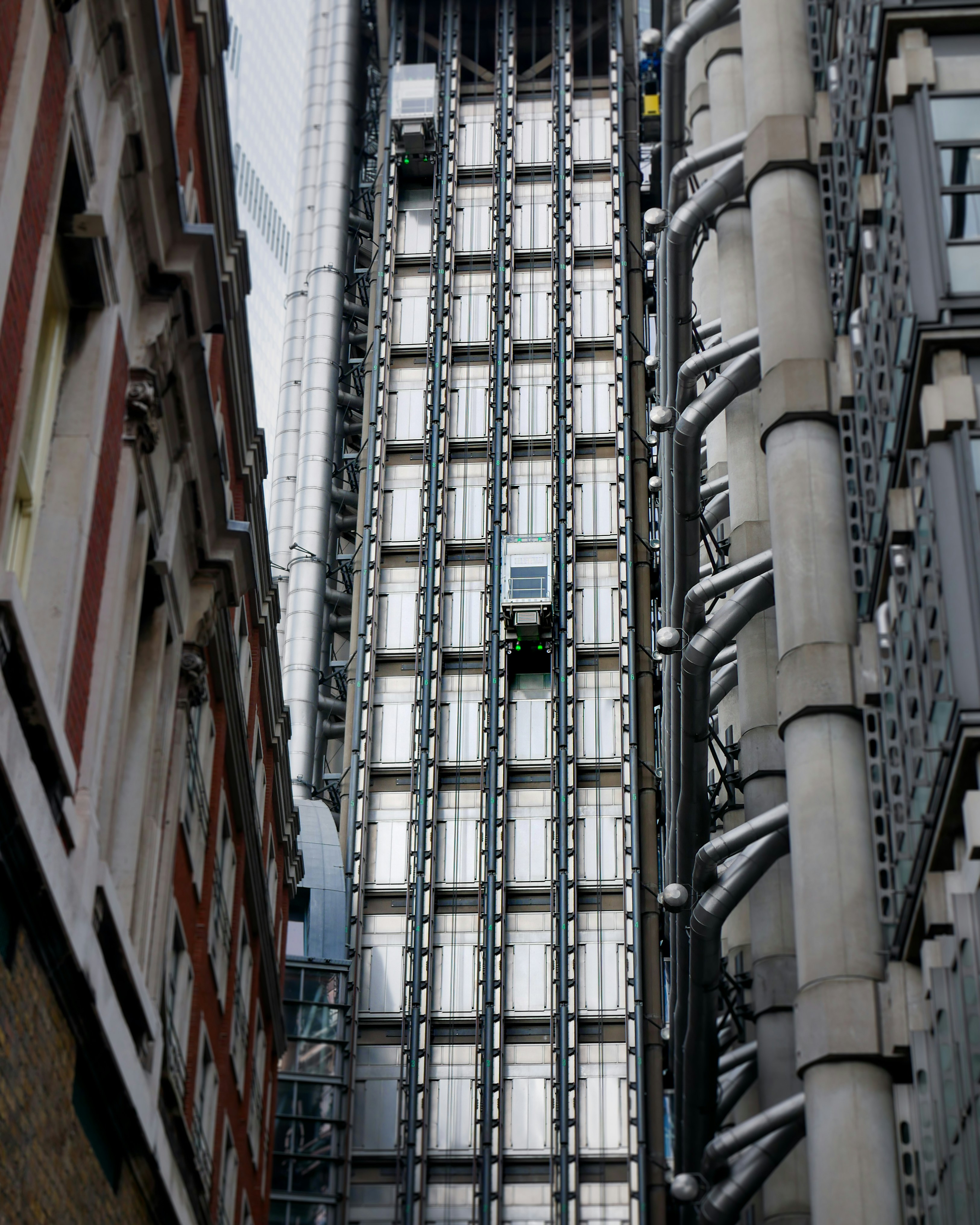 a tall building with lots of windows next to a tall building