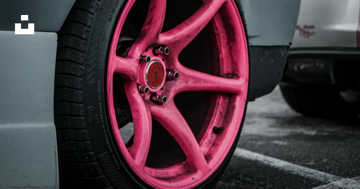 Pink Sticker For Rims A car with pink rims parked in a parking lot photo – Free Tire Image on ...