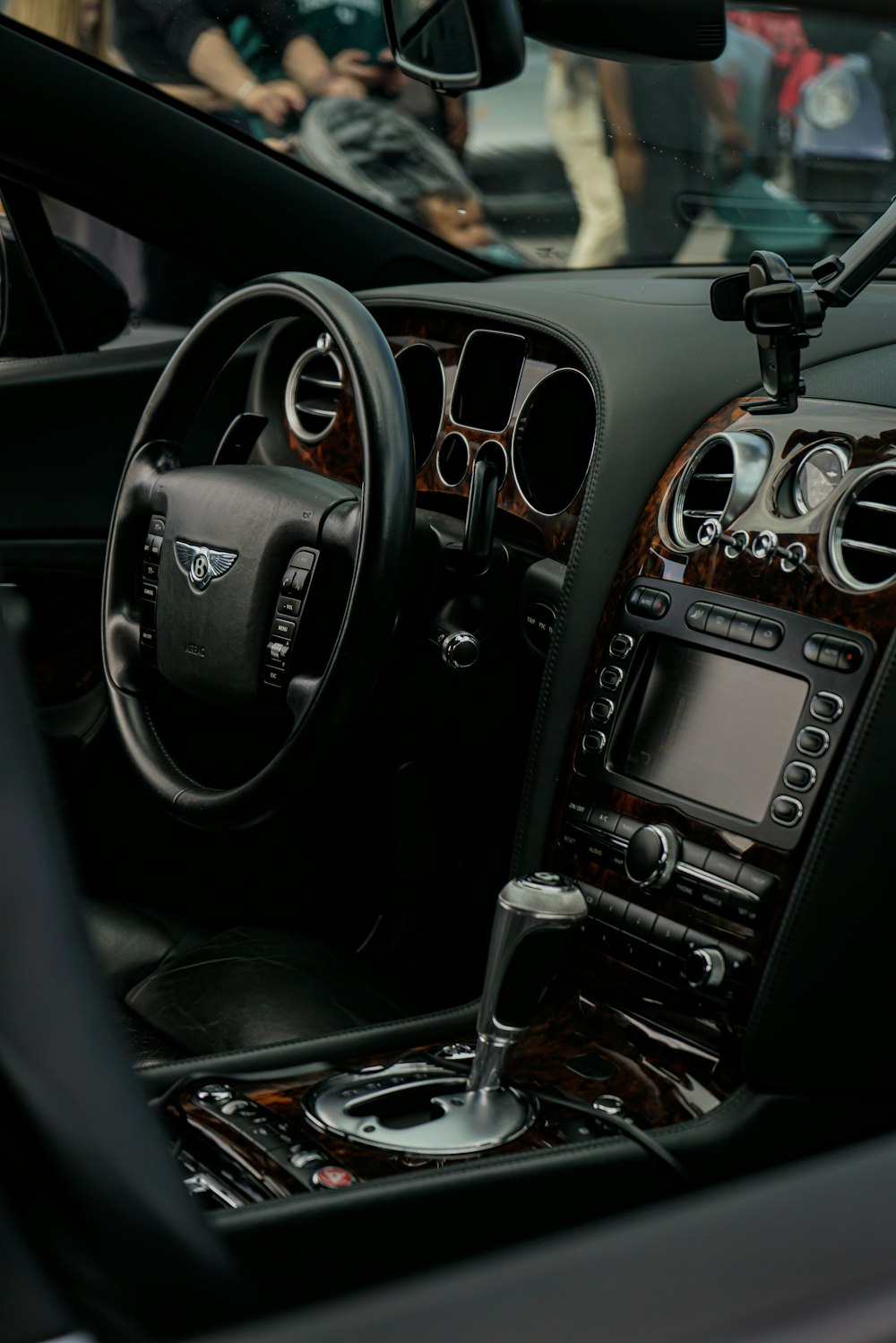 the interior of a car with a steering wheel and dashboard