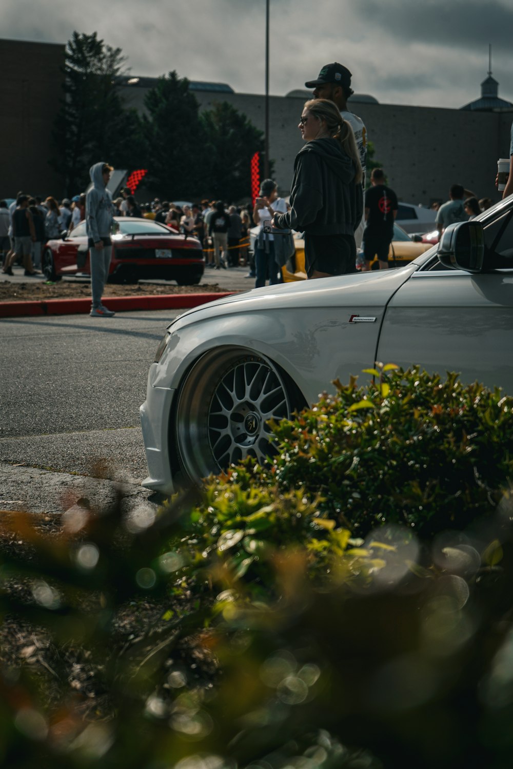 a white car parked on the side of a road