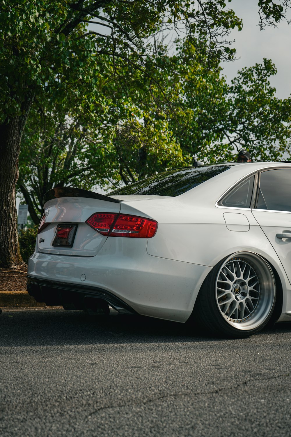 a white car parked on the side of the road