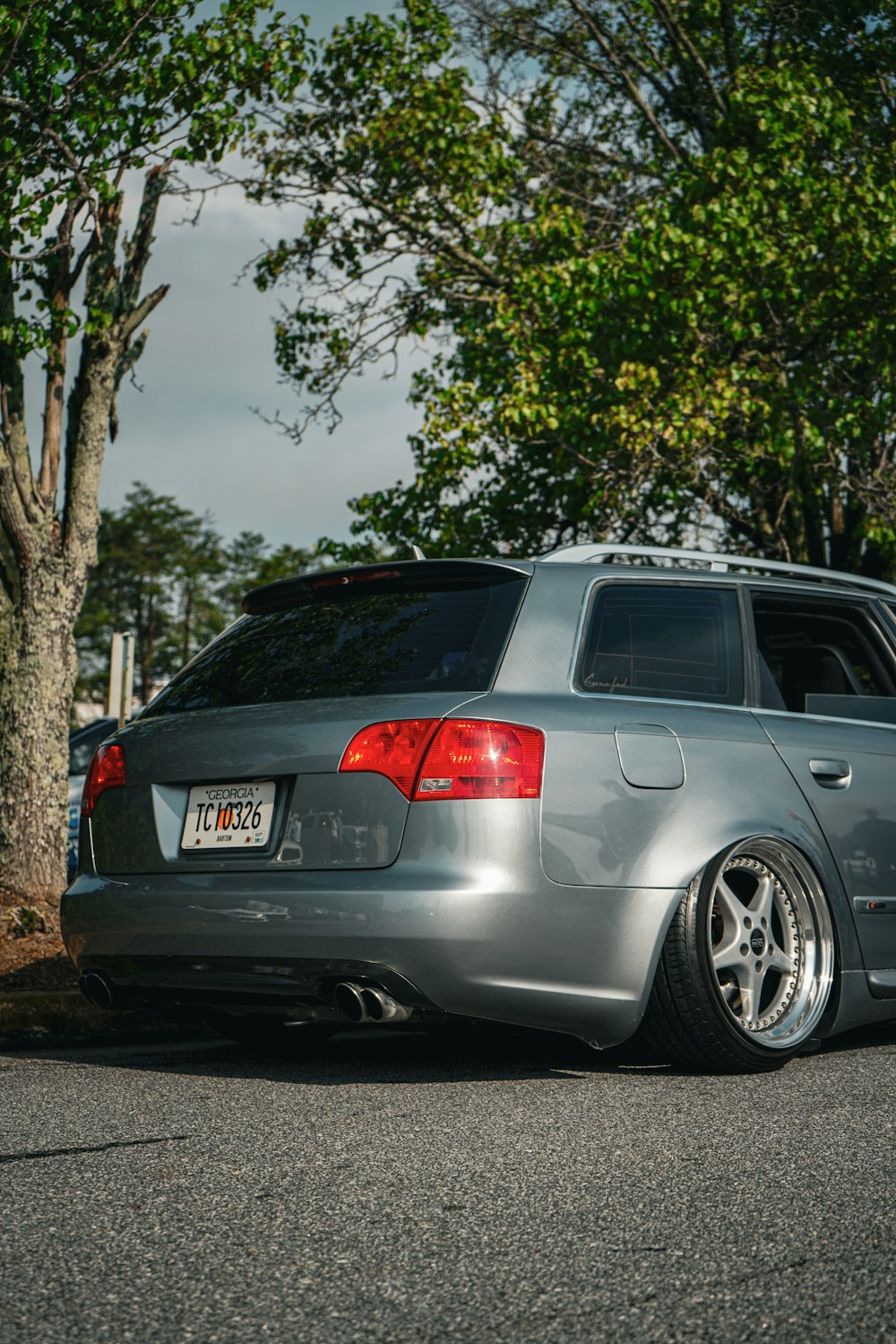 a silver car parked on the side of the road