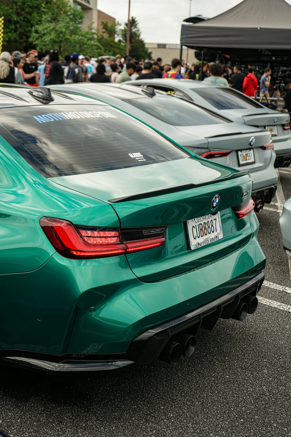 a group of cars parked in a parking lot