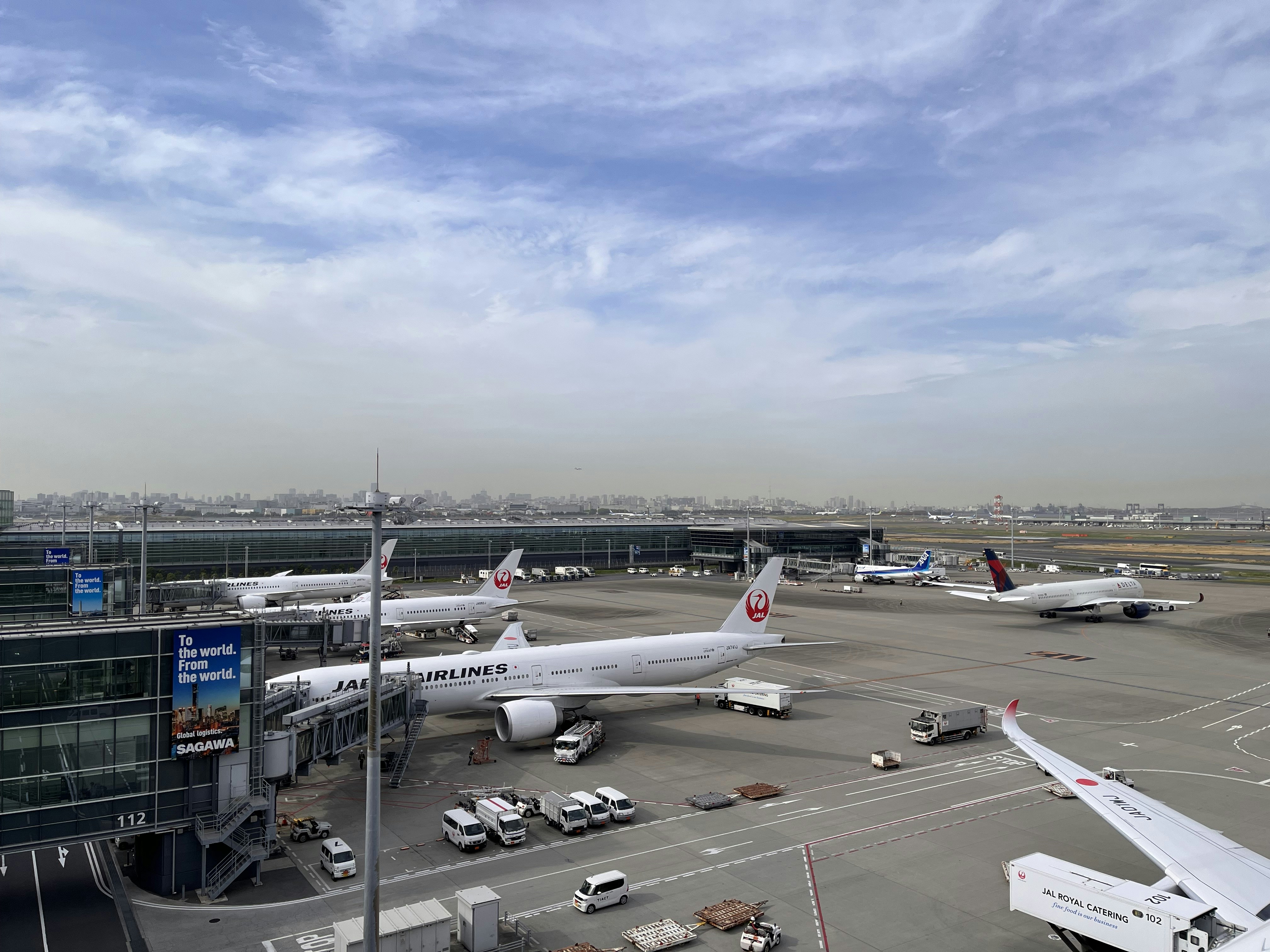 an airport with several planes parked on the tarmac