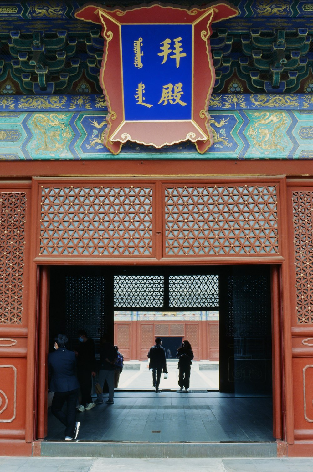 a group of people standing outside of a building