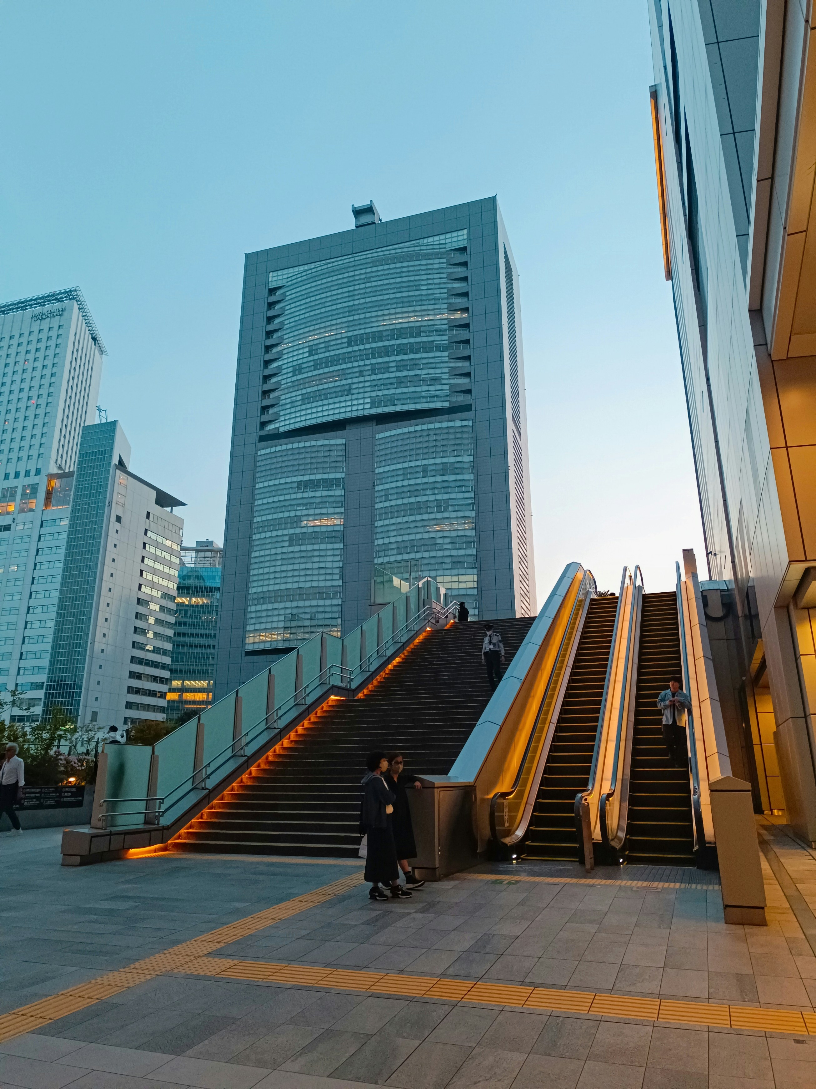 woman wearing yellow long-sleeved dress under white clouds and blue sky during daytime