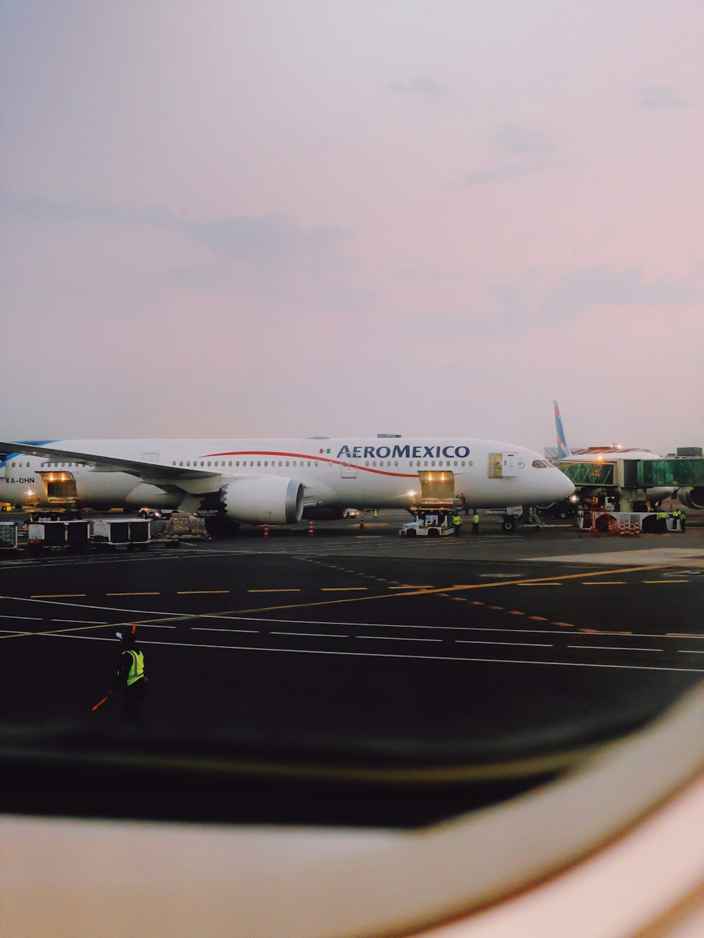 an airplane is parked on the tarmac at an airport