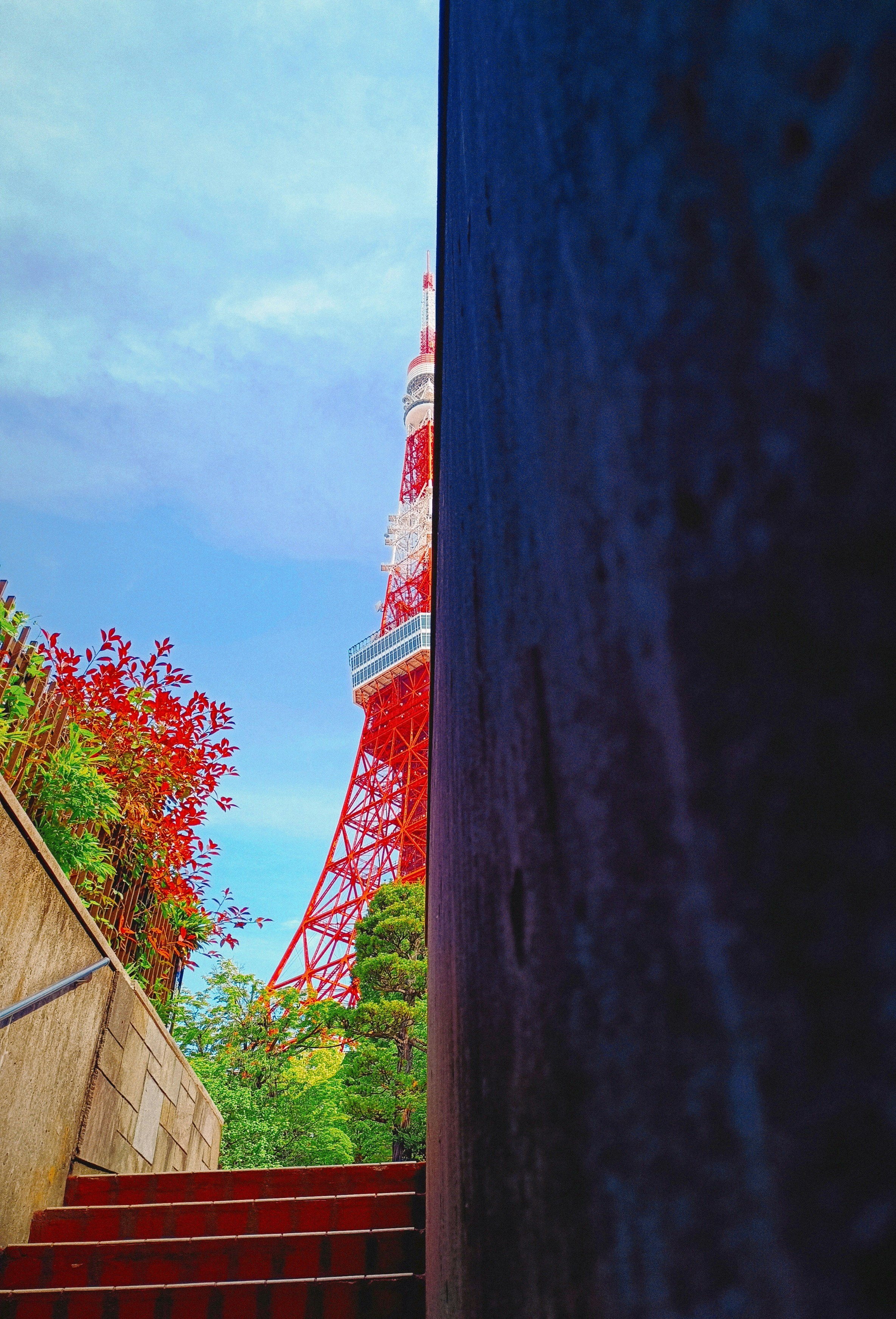 a view of the eiffel tower from the bottom of the stairs