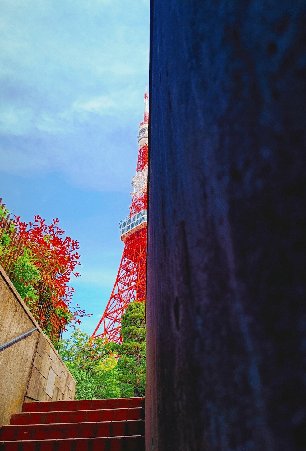 a view of the eiffel tower from the bottom of the stairs