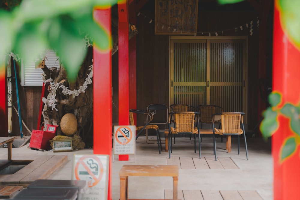 a room with chairs, tables and a statue