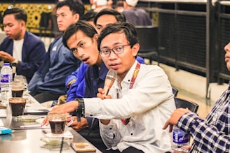 a group of people sitting at a table with drinks