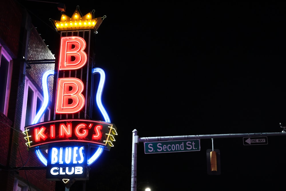 a neon sign on the side of a building