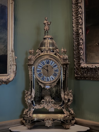a clock sitting on top of a table in a room