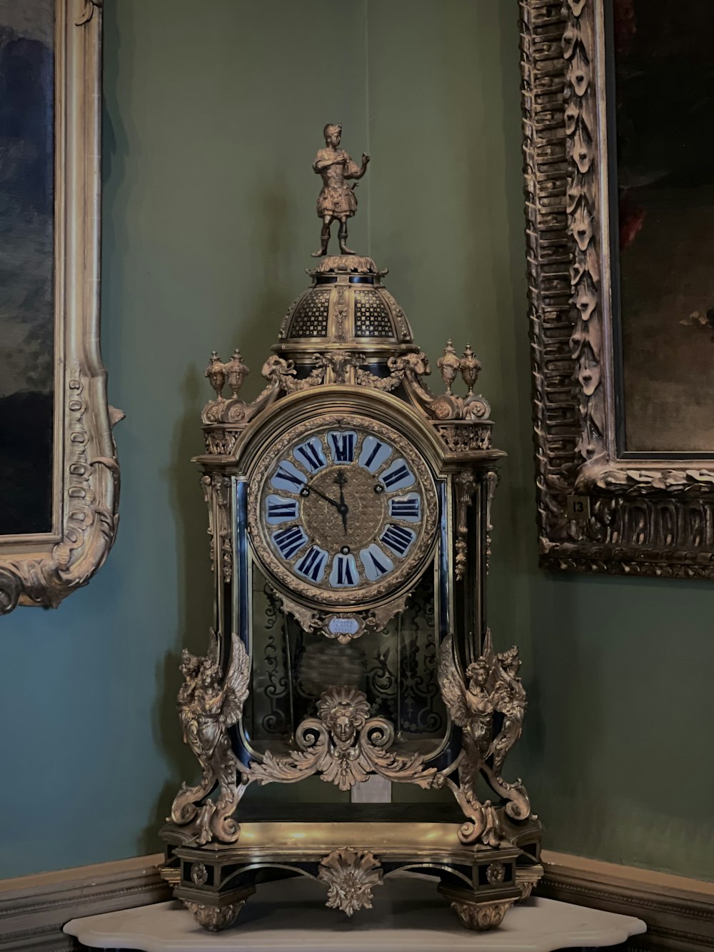 a clock sitting on top of a table in a room