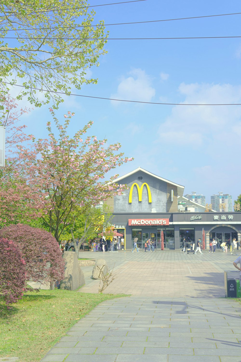 a mcdonald's restaurant with people walking around