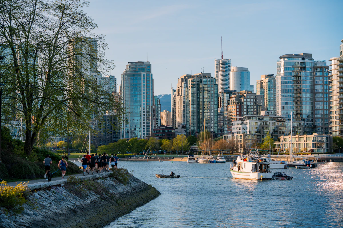 People walking along the False Creek seawall