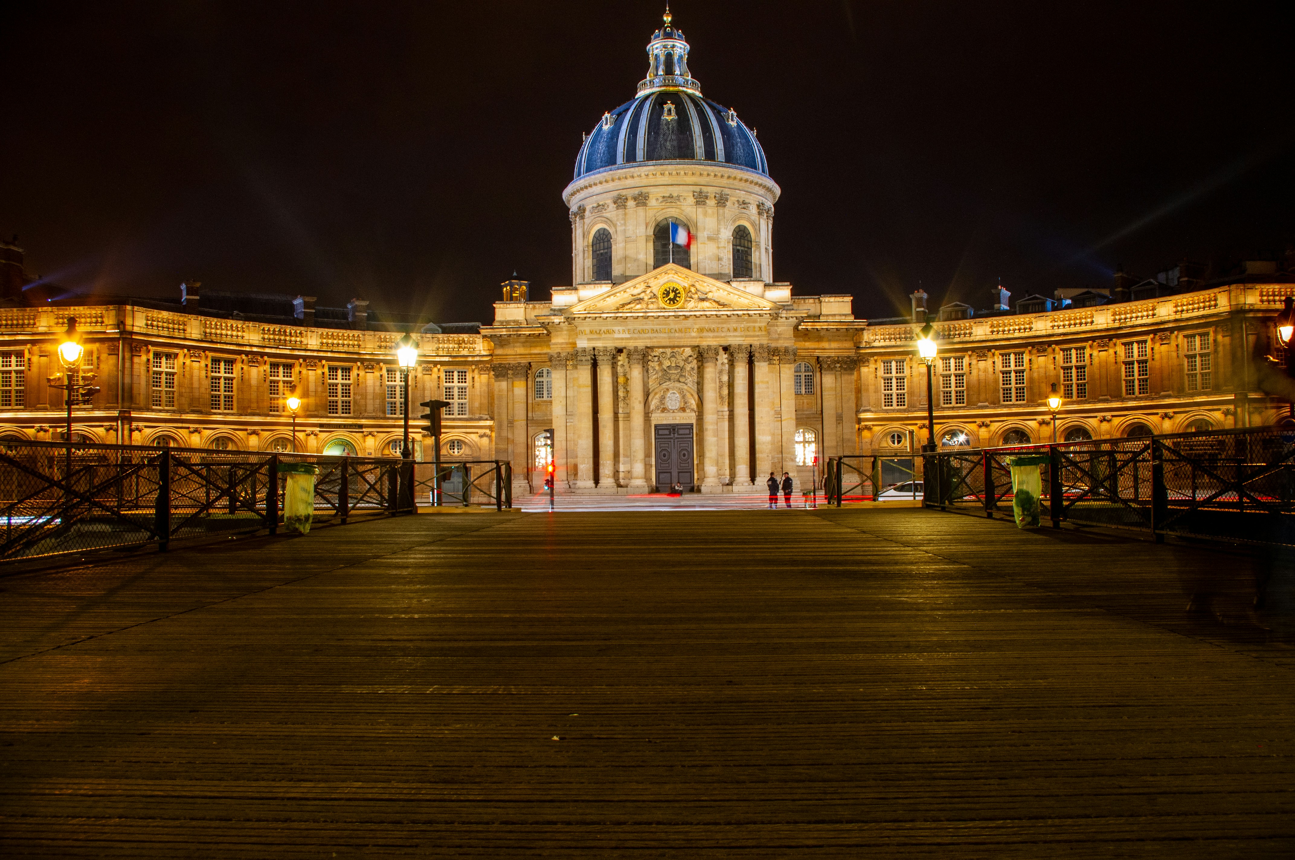 a large building with a blue dome at night