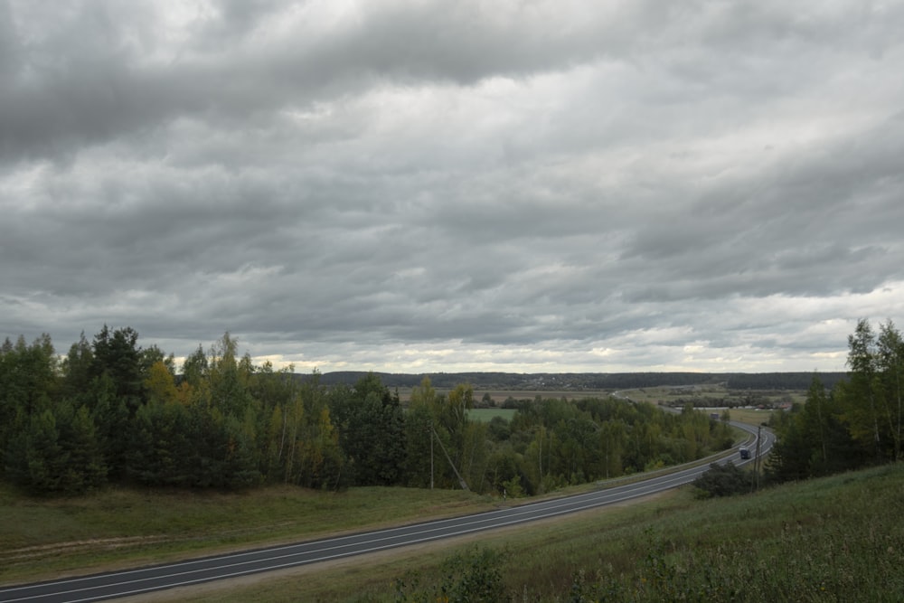 a road with a cloudy sky above it