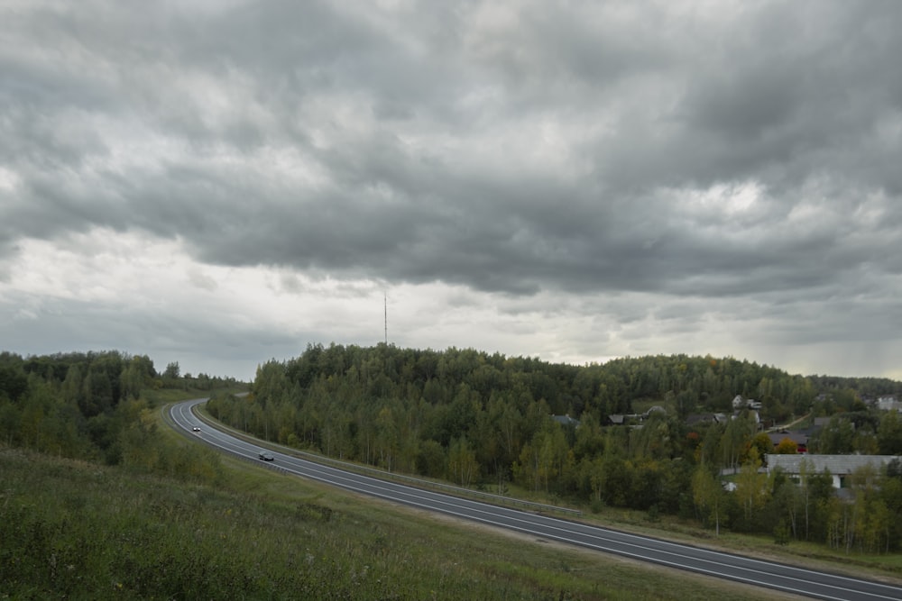 a road with a cloudy sky above it