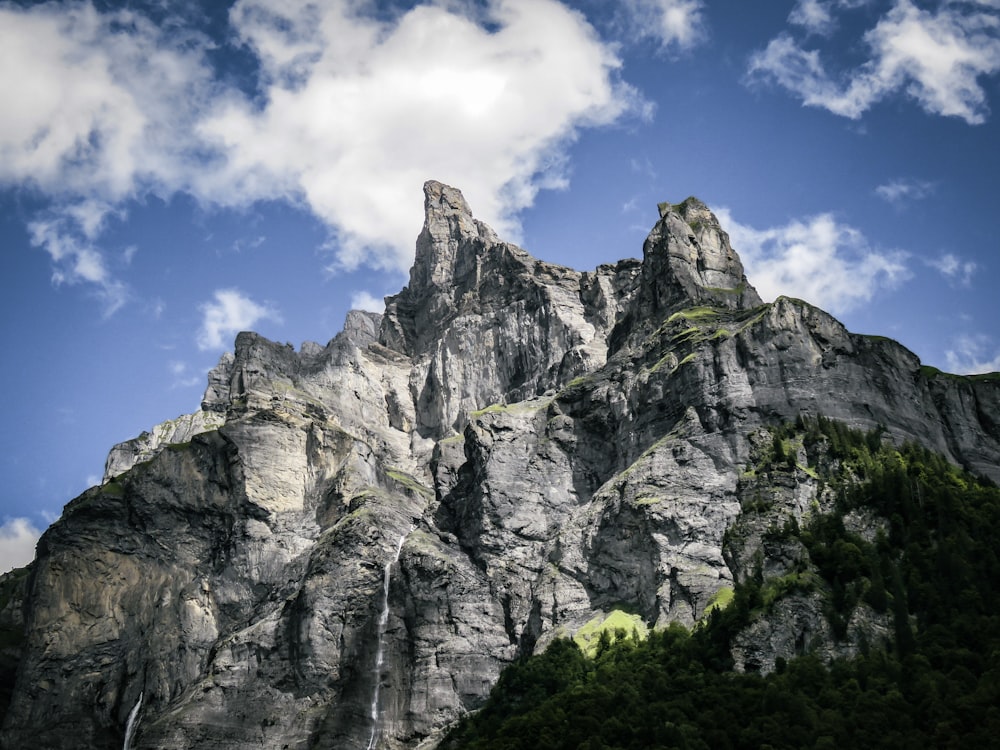 a very tall mountain with a sky background