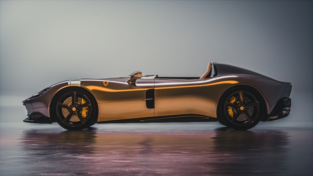 a gold colored sports car on a shiny surface