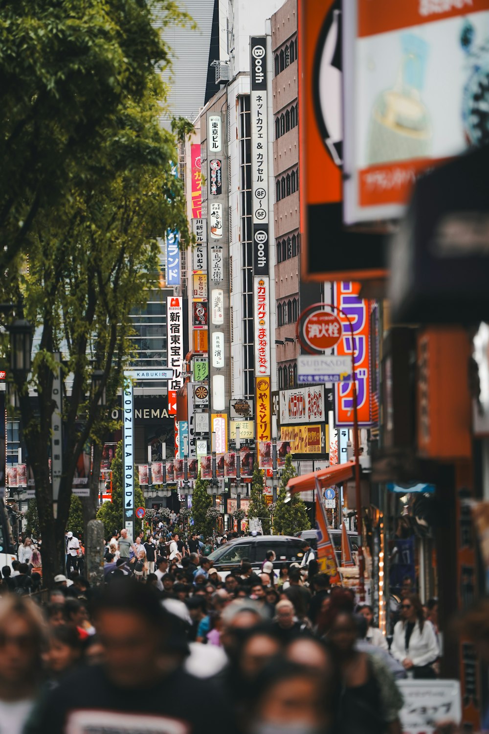 a crowded city street filled with lots of people