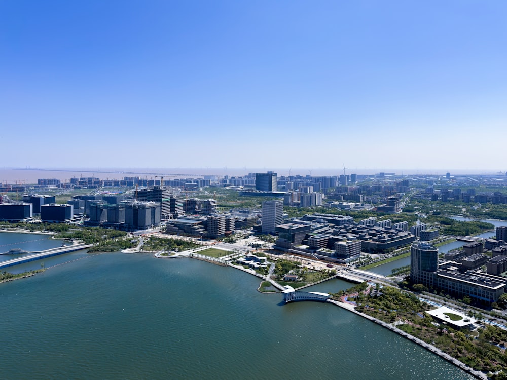 an aerial view of a city and a body of water