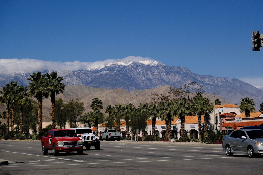 a city street with a mountain in the background