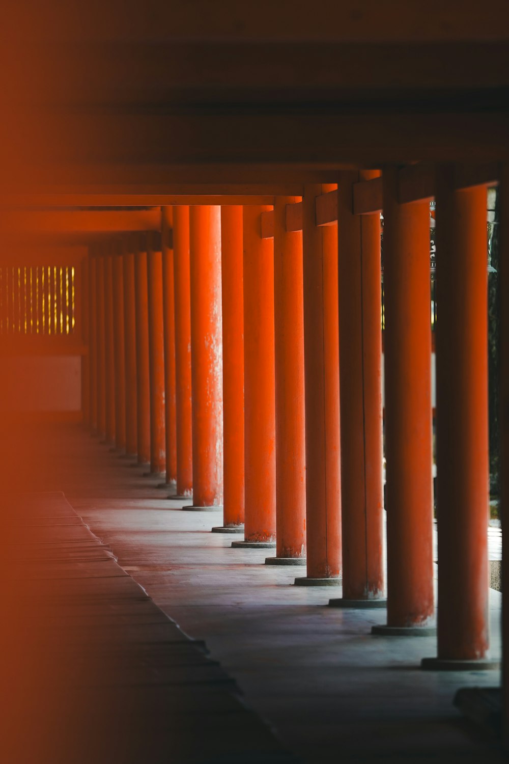 a row of orange columns in a building