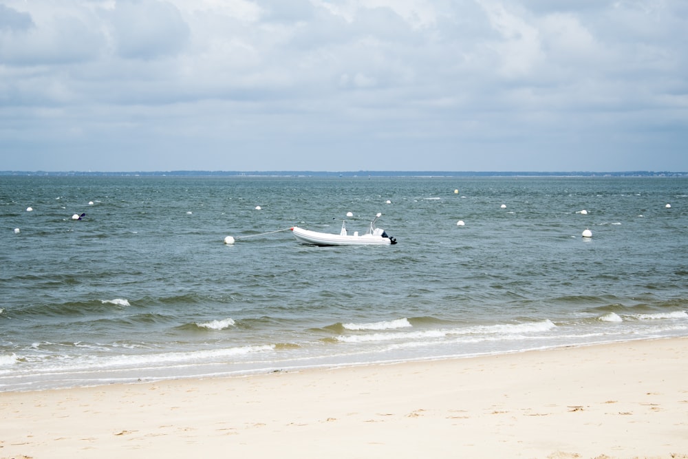 a boat floating on top of a body of water